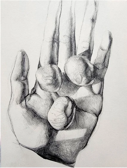 A hand holding round stones