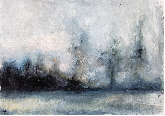A misty treeline at the edge of still water