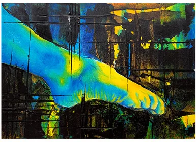 A foot in yellow and blue against dark marks