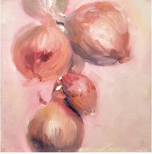 A cluster of onions in warm pink tones