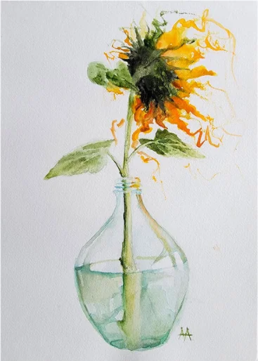 A sunflower in a glass bottle